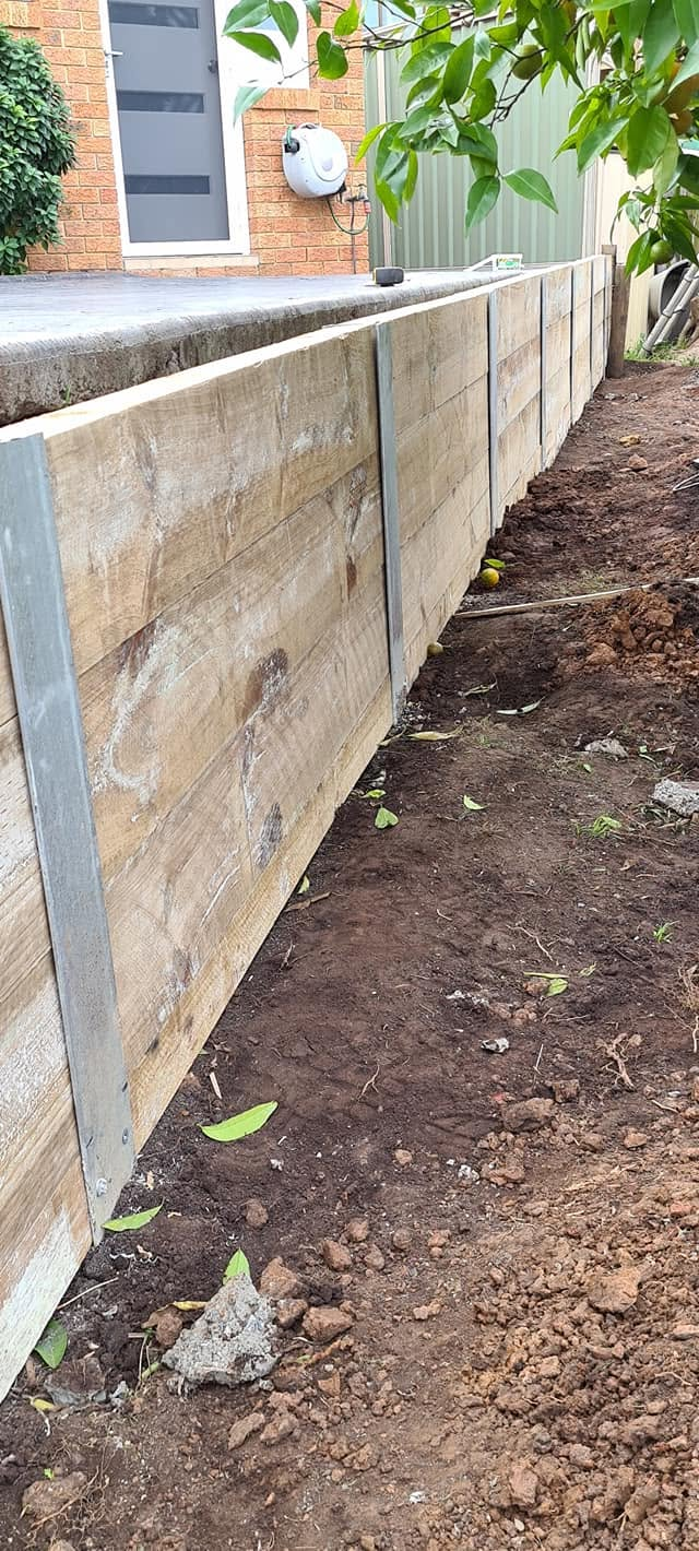 Retaining wall construction underway on a residential block in Dapto