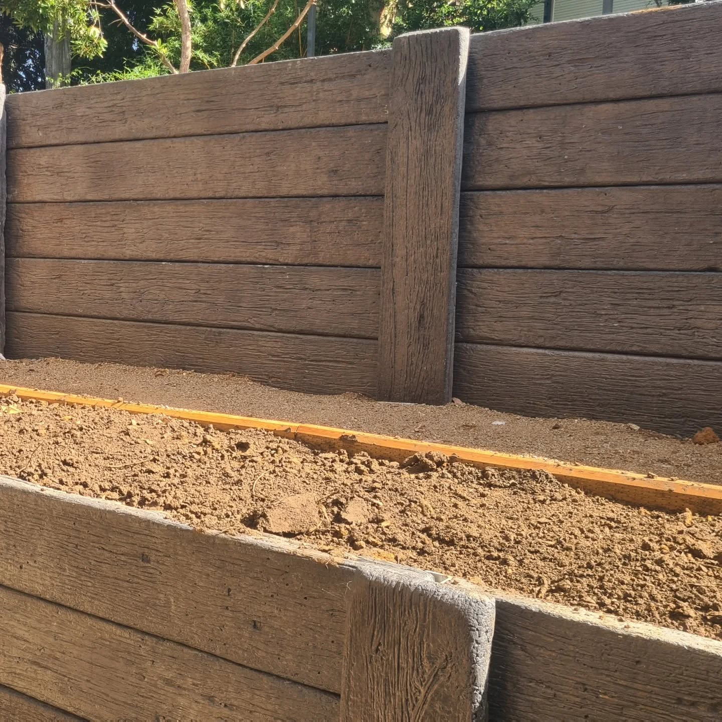 Finished retaining wall and landscaped yard completed by Retain by Theo in Dapto