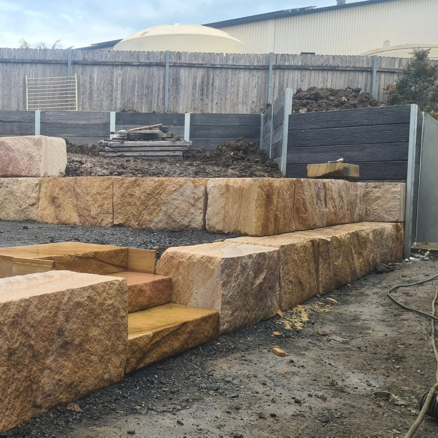 Finished retaining wall and landscaped yard completed by Retain by Theo in Thirroul