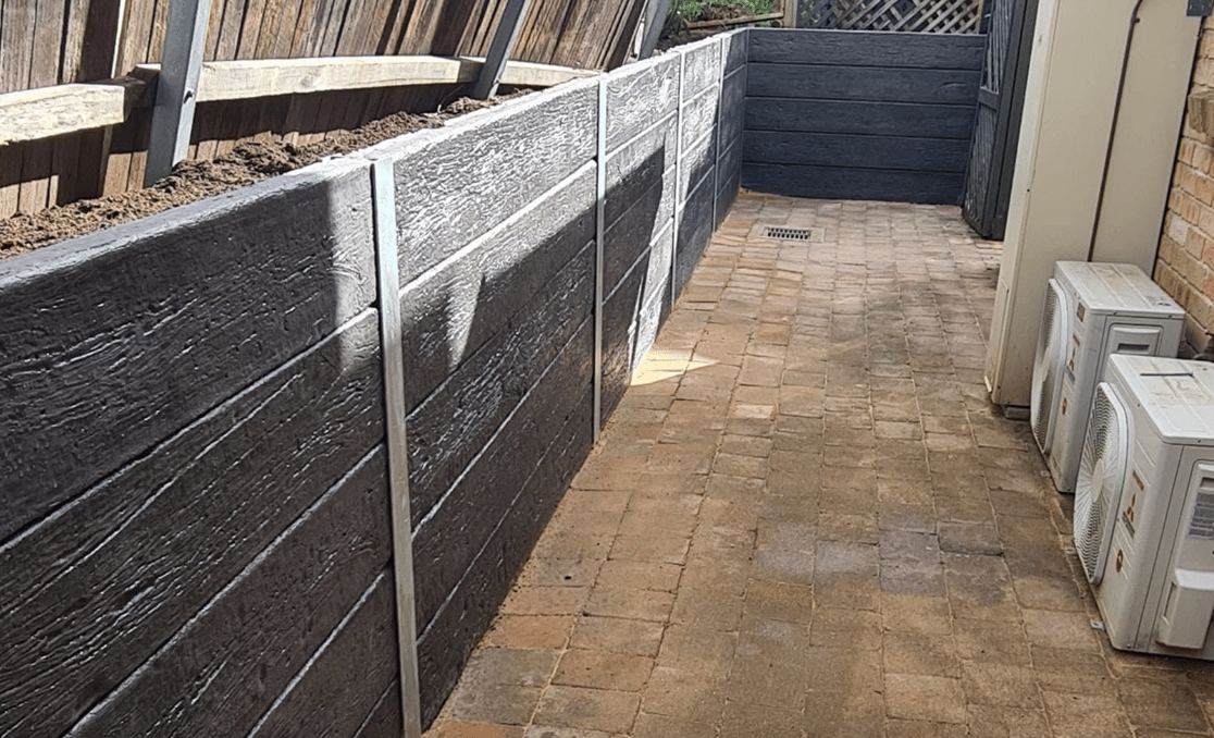 Retaining wall construction underway on a residential block in Balgownie