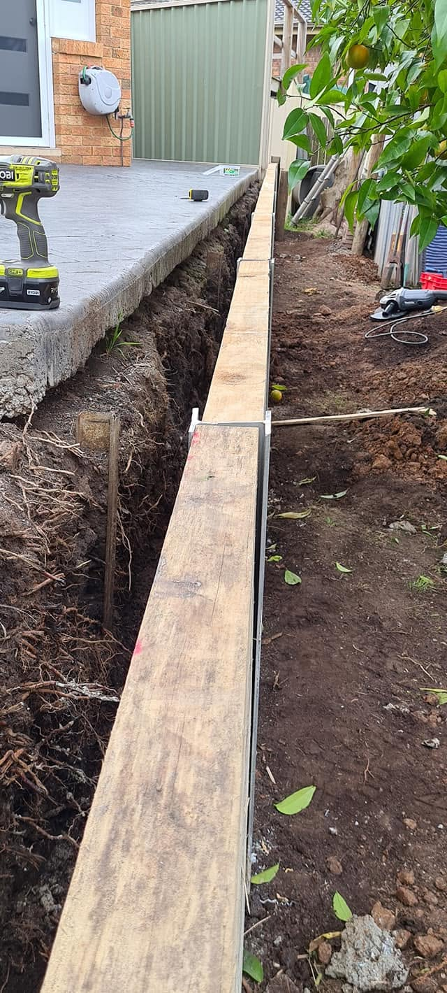 Concrete sleeper retaining wall under construction by Retain by Theo near Bulli