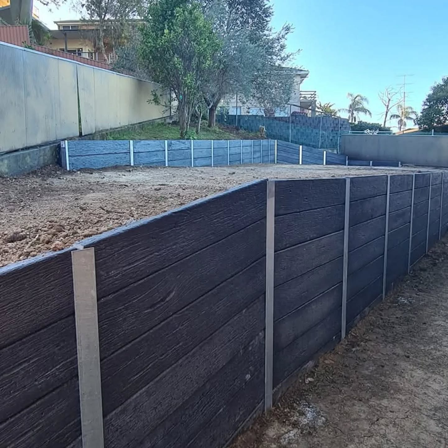 Finished retaining wall and landscaped yard completed by Retain by Theo in Huntley