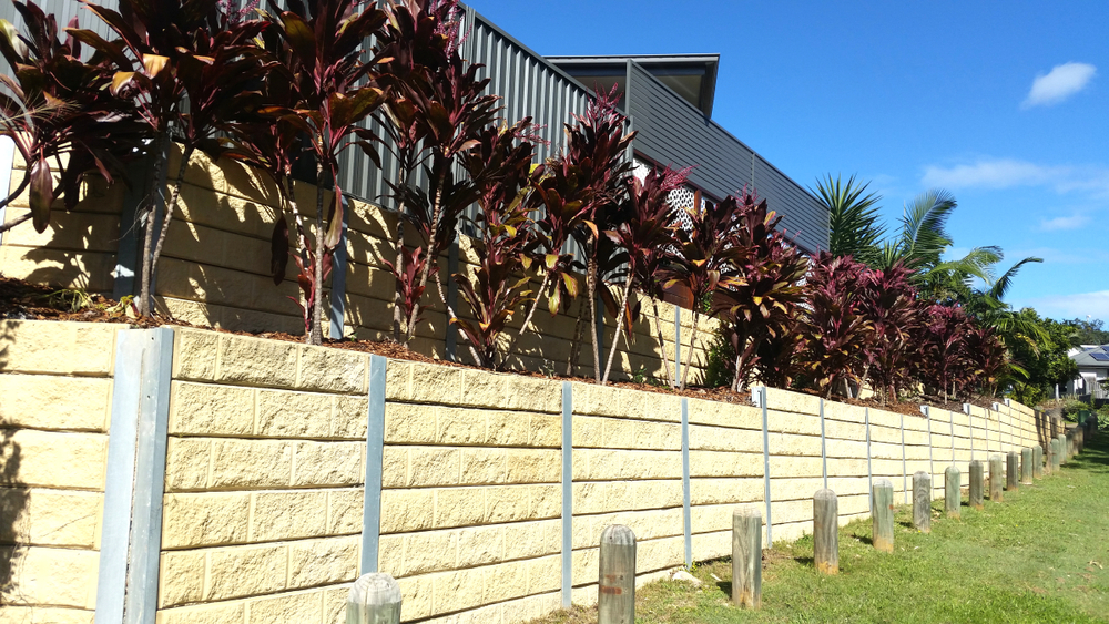 Multi-tiered block retaining wall completed by Retain by Theo for a suburban Illawarra home