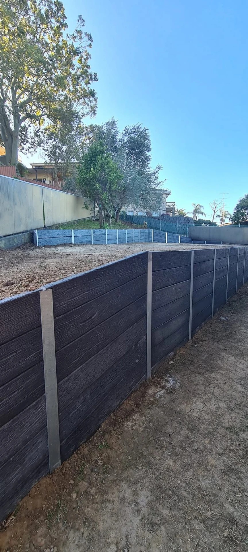 Finished retaining wall and landscaped yard completed by Retain by Theo in Shellharbour
