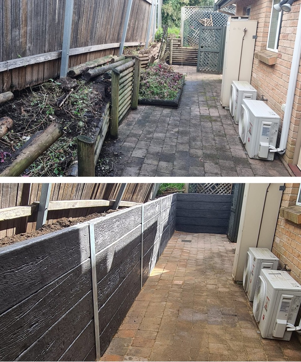 Narrow side yard rebuilt with charcoal concrete sleeper garden walls
